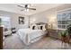 Charming bedroom featuring a ceiling fan, neutral decor, and comfortable carpeting at 11143 Coachman Cir, Charlotte, NC 28277