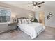 Cozy bedroom features a comfy bed, ceiling fan, and lots of natural light at 11143 Coachman Cir, Charlotte, NC 28277