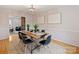 Cozy dining room with an eye-catching wooden table, chic decor, and inviting neutral tones at 11143 Coachman Cir, Charlotte, NC 28277