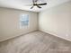 Bright bedroom featuring ceiling fan and neutral wall tones at 118 Cadbury Ln, Fort Mill, SC 29715