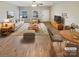 Virtually staged living room with light beige furniture and hardwood floors at 118 Cadbury Ln, Fort Mill, SC 29715