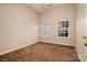 Bedroom features neutral walls, carpet, and natural light from the two windows at 12016 Regent Ridge Ln, Charlotte, NC 28278