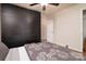 Cozy bedroom featuring neutral walls, carpet, fan and modern built in closet at 12016 Regent Ridge Ln, Charlotte, NC 28278