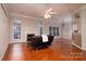 Spacious living room with wood floors, fireplace, and plenty of natural light at 12016 Regent Ridge Ln, Charlotte, NC 28278