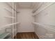 Empty walk-in closet featuring multiple rows of wire shelving for optimal storage solutions at 12016 Regent Ridge Ln, Charlotte, NC 28278