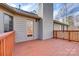 Enjoy outdoor living on this back deck featuring a door and light fixture at 12104 Baywoods Dr, Tega Cay, SC 29708