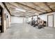 Unfinished basement with concrete floor, insulation, and overhead lighting at 12104 Baywoods Dr, Tega Cay, SC 29708