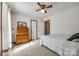 Bright bedroom features a ceiling fan, soft carpet, and a dresser at 12104 Baywoods Dr, Tega Cay, SC 29708