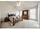 Traditional bedroom features carpet, natural light, ceiling fan, and a wooden dresser at 12104 Baywoods Dr, Tega Cay, SC 29708