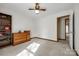 Simple bedroom with neutral carpet, a dresser, and a bookcase at 12104 Baywoods Dr, Tega Cay, SC 29708