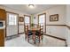 Cozy dining room features a round table, four chairs, and natural light from the window at 12104 Baywoods Dr, Tega Cay, SC 29708