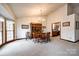 Bright dining room with a chandelier, ample natural light, and classic wooden furniture at 12104 Baywoods Dr, Tega Cay, SC 29708