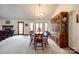 Elegant dining area featuring a large china cabinet, classic furniture, and ample space for gatherings at 12104 Baywoods Dr, Tega Cay, SC 29708