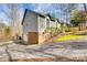 A home's exterior shows attached garage with driveway and lush yard at 12104 Baywoods Dr, Tega Cay, SC 29708