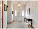 Bright foyer with a white double door entry, neutral carpet, and classic decor at 12104 Baywoods Dr, Tega Cay, SC 29708