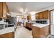 The kitchen features wooden cabinets, white countertops, and stainless steel appliances at 12104 Baywoods Dr, Tega Cay, SC 29708