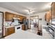 Open kitchen boasts classic cabinetry, stainless appliances, and seamless flow to dining area at 12104 Baywoods Dr, Tega Cay, SC 29708