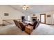 Open living room with vaulted ceiling, fireplace, neutral carpet, and comfortable seating at 12104 Baywoods Dr, Tega Cay, SC 29708