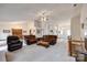 Expansive living area showcasing a fireplace, open layout, and seamless flow to the dining room at 12104 Baywoods Dr, Tega Cay, SC 29708