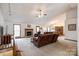 Spacious living room featuring a fireplace, vaulted ceilings, and access to the dining area at 12104 Baywoods Dr, Tega Cay, SC 29708