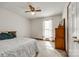 Serene main bedroom featuring soft carpet, ceiling fan, natural light, and classic furnishings at 12104 Baywoods Dr, Tega Cay, SC 29708