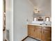 Convenient wet bar with sink, light countertop and wooden cabinets next to the living room at 12104 Baywoods Dr, Tega Cay, SC 29708