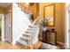 Grand staircase with wooden railings and neutral color scheme at 1548 Summit View Dr, Rock Hill, SC 29732