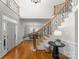 Grand foyer with hardwood floors and staircase leading to the second floor at 1604 Windy Ridge Rd, Charlotte, NC 28270