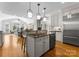 Modern kitchen with stainless steel appliances, granite countertops and views into adjacent dining area at 1604 Windy Ridge Rd, Charlotte, NC 28270