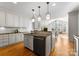 Modern kitchen with stainless steel appliances, granite countertops and large windows at 1604 Windy Ridge Rd, Charlotte, NC 28270