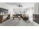 Cozy living room with a large sectional sofa, ceiling fan, and plenty of natural light at 1604 Windy Ridge Rd, Charlotte, NC 28270