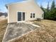 Small backyard with a concrete patio and some grass at 1633 Barroso Ln, Charlotte, NC 28213