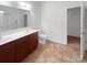 Bathroom with double vanity, a toilet, and a linen closet at 1633 Barroso Ln, Charlotte, NC 28213