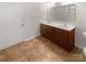 Double vanity bathroom with tiled floor at 1633 Barroso Ln, Charlotte, NC 28213