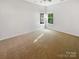 Bright bedroom with neutral walls and carpeted floors at 1633 Barroso Ln, Charlotte, NC 28213