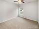 Well-lit bedroom with carpet and window at 1633 Barroso Ln, Charlotte, NC 28213