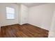 Bedroom with window, closet, and hardwood floors at 164 N Cromwell Dr, Mooresville, NC 28115