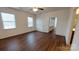 Spacious bedroom with hardwood floors and two windows at 164 N Cromwell Dr, Mooresville, NC 28115