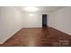 Simple dining room with hardwood floors and chandelier at 164 N Cromwell Dr, Mooresville, NC 28115