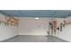 Garage with overhead storage, epoxy flooring, and EV charger at 164 N Cromwell Dr, Mooresville, NC 28115