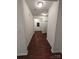 Hallway featuring hardwood floors and access to other rooms at 164 N Cromwell Dr, Mooresville, NC 28115