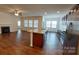 Modern kitchen with granite countertops, stainless steel appliances, and a large center island at 164 N Cromwell Dr, Mooresville, NC 28115
