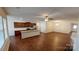 Open-concept living space with dark wood floors, stainless steel appliances, and plenty of natural light at 164 N Cromwell Dr, Mooresville, NC 28115