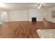 Spacious living room showcasing dark wood floors, a cozy fireplace, and an open layout at 164 N Cromwell Dr, Mooresville, NC 28115