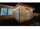 Covered patio with lattice walls, string lights, and concrete flooring at 164 N Cromwell Dr, Mooresville, NC 28115