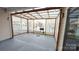 The outdoor patio offers a view of the grill and backyard with a protective lattice perimeter and transparent roof at 164 N Cromwell Dr, Mooresville, NC 28115