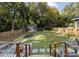 Picturesque backyard featuring a basketball court, play area, and an elevated outdoor space at 1740 Wilmore Dr, Charlotte, NC 28203