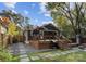 Outdoor living space with a wooden deck, grill, and a comfortable seating area for entertaining at 1740 Wilmore Dr, Charlotte, NC 28203