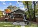 Cozy backyard featuring a wooden deck, a fire pit area, and comfortable bench seating at 1740 Wilmore Dr, Charlotte, NC 28203