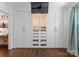 Organized walk-in closet with custom shelving and cabinets, providing ample storage and display space at 1740 Wilmore Dr, Charlotte, NC 28203